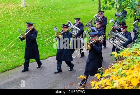 Bournemouth, Dorset UK. 14th November 2021. Remembrance Sunday Parade and wreath laying service - representatives of armed services, forces groups and cadets parade through Bournemouth gardens followed by a service and wreath laying at the War Memorial in Central Gardens. Crowds gather to pay their respects and remember the fallen on a mild day. This year coincides with the centenary year of the Royal British Legion. Salvation Army brass band marching through the gardens. Credit: Carolyn Jenkins/Alamy Live News Stock Photo