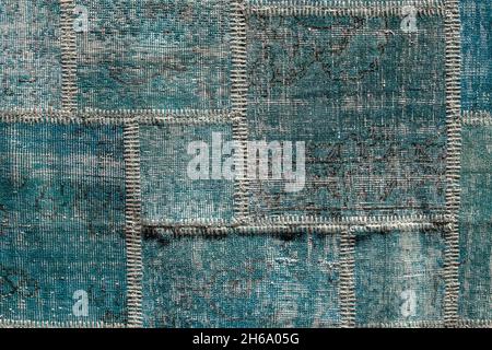 Detail of old asian patchwork carpet background and texture. Close up Stock Photo