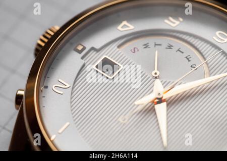 Retrograde weekday indicator of a classic luxury wrist watch Stock Photo