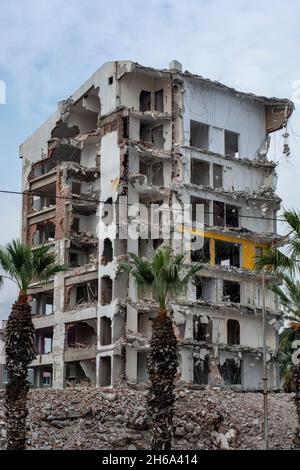 The high-rise building damaged in the earthquake is being demolished Stock Photo