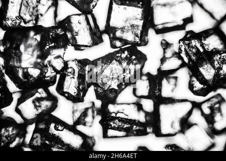 Crystal sugar close up on white background under the light microscope with a magnification of 40 times Stock Photo
