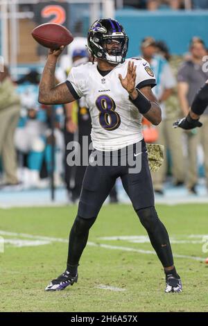Baltimore Ravens quarterback Lamar Jackson winds up to throw a pass ...