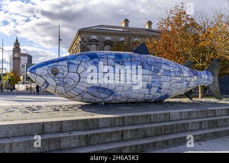 BELFAST, UNITED KINGDOM - Oct 15, 2021: The salmon of knowledge also known as the big fish an art installation in Belfast with the famous Albert memor Stock Photo