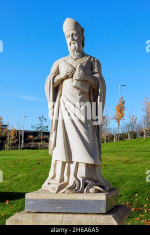 Statue of St Mungo, the patron saint of Glasgow situated near Cathedral Street, Glasgow. The statue was gifted to the city Stock Photo