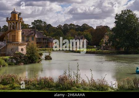 Queen’s Hamlet (Le Hameau de la Reine) - Rural House Buildings - Marie-Antoinette and Marlborough Tower near a Lake in Versailles Palace Gardens (Chat Stock Photo