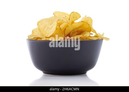 Potato chips in black ceramic cup isolated on white Stock Photo