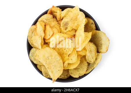 Potato chips in black ceramic cup isolated on white. View from above Stock Photo