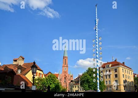 View to historical Maypole at square 'Wiener Platz' near the Isar and the Gasteig in the old town of Munich-Haidhausen, Bavaria Germany Europe Stock Photo