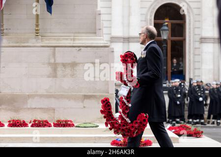 London, UK. 14th Nov, 2021. A dignitary seen walking towards the Cenotaph to lay his poppy wreath.The Remembrance Sunday Service is an annual ceremony held on the week of the Remembrance day, 11st Nov. National leaders, the Royal family and dignitaries come together to pay tribute to nationals who have fought and died in the two world war, as a celebration of world peace. Poppies are worn and poppy wreaths laid around the Cenotaphs as a practice. Credit: SOPA Images Limited/Alamy Live News Stock Photo
