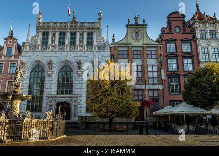 GDANSK, POLAND - Oct 08, 2021: The Neptune's Fountain in front of the entrance to the Artus Court in the old city of Gdansk, Poland Stock Photo