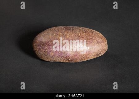 red potato on black background Stock Photo