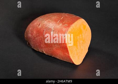 sliced sweet potato on black background Stock Photo