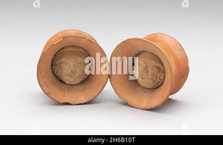 Pair of Earspools with Face in Interior, Possibly AD 450/1000. Stock Photo