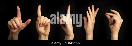 Set of hand gestures on a black background. Woman hand, business signs, banner Stock Photo