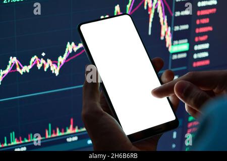Crypto trader using phone mockup screen for stock trading mobile app. Stock Photo