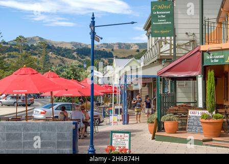 Waterfront shops and restaurants, Beach Road, Akaroa, Banks Peninsula, Canterbury, New Zealand Stock Photo