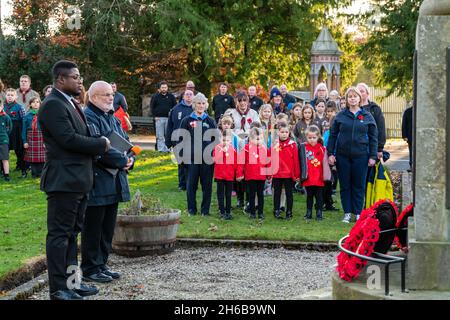 FOCHABERS, MORAY, UK. 14th Nov, 2021. This is a scene from Village Remembrance at Fochabers, Moray, Scotland on Sunday 14 November 2021. Fochabers Rainbows remember with the Ministers and all gathered. Credit: JASPERIMAGE/Alamy Live News Stock Photo