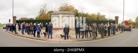 Greenwich, London, UK. 14th November 2021. panorama view of local Residents, fire brigade crew, veterans, scout group and local councillors gather to pay their respects on Remembrance Sunday at the war memorial Maze Hill Greenwich. Credit: Xiu Bao/Alamy Live News Stock Photo