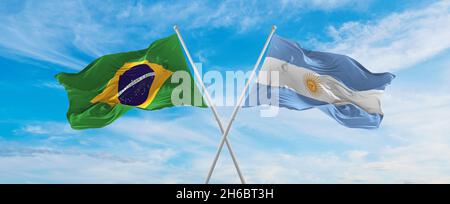 crossed national flags of Brazil and Argentina flag waving in the wind ...