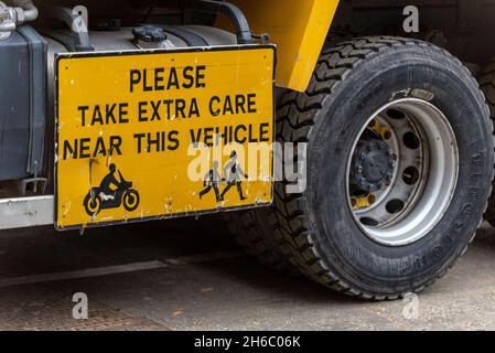 Warning on side of lorry highlighting the danger to motorcyclists and pedestrians of getting too close. Risk of being run over by heavy goods  vehicle Stock Photo