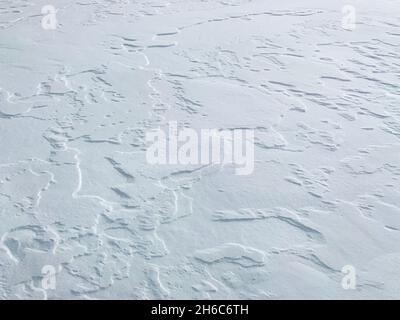 Snowy surface with a perspective angle. With more sharpness in the foreground. Stock Photo