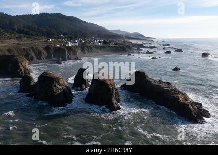 The serene Pacific Ocean washes onto the rugged coastline of Northern California at Westport. The Pacific Coast Highway runs along this scenic region. Stock Photo