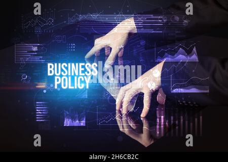 Businessman touching huge screen concept Stock Photo