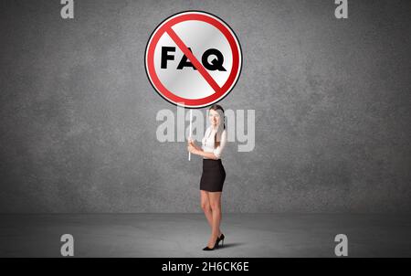 Young business person holdig traffic sign Stock Photo
