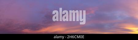 Beautiful view of sky with clouds at sunrise. Partly cloudy. Colorful sunset. Natural sky background texture, beautiful color. Sunset landscape in the Stock Photo