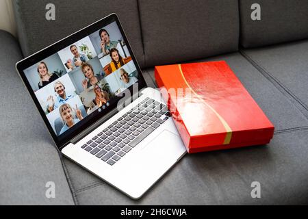 Online Party During Quarantine. online video call, showing present gift box, videochat. Screen view with conference app Stock Photo