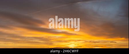 Fiery sunset, colorful clouds in the sky Stock Photo