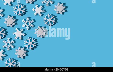 Christmas background. Snowflake pattern. White snowflakes on blue. Snow. Winter mood. Conceptual abstraction. Styrofoam snowflake. New Year's pattern. Copy space. Texture. Stock Photo