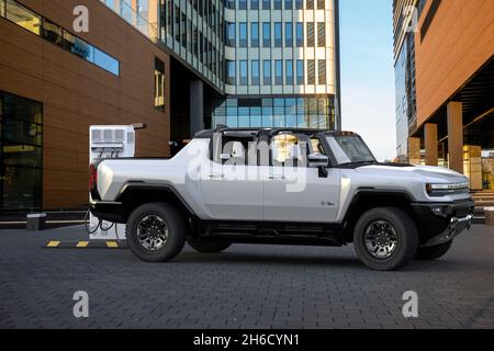GMC HUMMER EV Pickup, All-Electric Truck on fast charging station Stock Photo