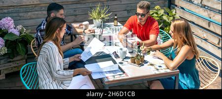 People working on the terrace of the office Stock Photo