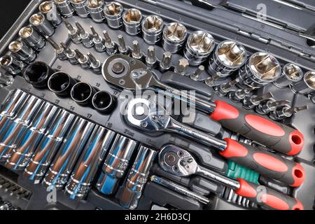 A set of various tools (wrenches, heads, cranks, ratchets) in a case. View from above Stock Photo