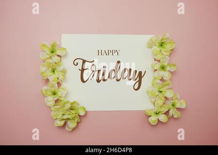 Happy Friday card typography text with flower bouquet on pink background Stock Photo