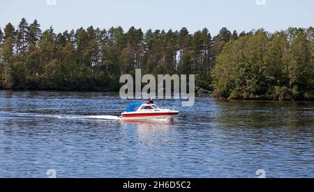 Umea, Norrland Sweden - June 17, 2019: motorboat on the river during a fantastic summer day Stock Photo