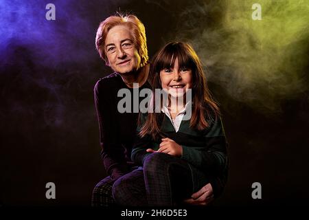 genarcional gap in family portrait between grandmother and granddaughter. portrait in original studio. Stock Photo