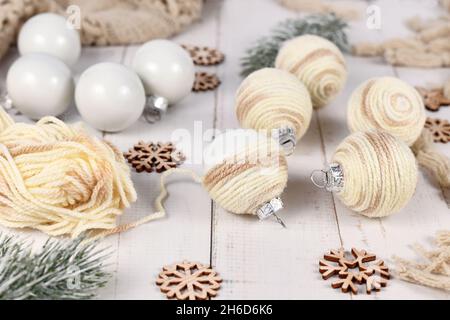 Do it yourself boho style Christmas bauble ornaments with cream colored cord Stock Photo