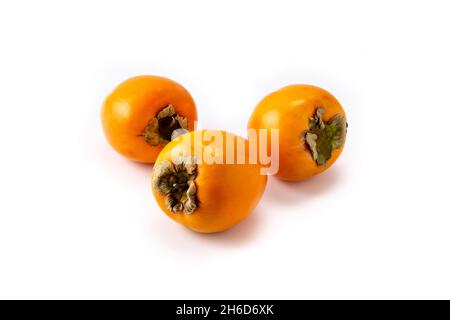 Fresh persimmon fruit isolated on white background Stock Photo