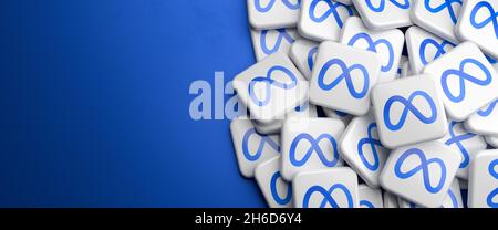 Logos of the new Facebook company Meta on a heap. Web banner size with copy space - Selective focus Stock Photo