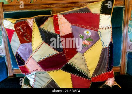 Crazy patchwork cushion on a chair in the 1890 Farm House Museum, Billings Farm & Museum, Woodstock, Vermont, New England, USA Stock Photo