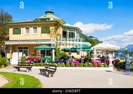 ST. GILGEN, AUSTRIA - MAY 17, 2017: Restaurant and public park in St Gilgen village, Salzkammergut region of Austria. St Gilgen located at Wolfgangsee Stock Photo