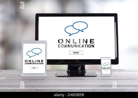 Online communication concept shown on different information technology devices Stock Photo