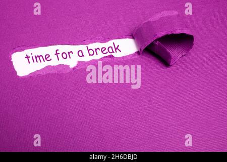 The text TIME TO BREAK appearing behind torn purple paper Stock Photo