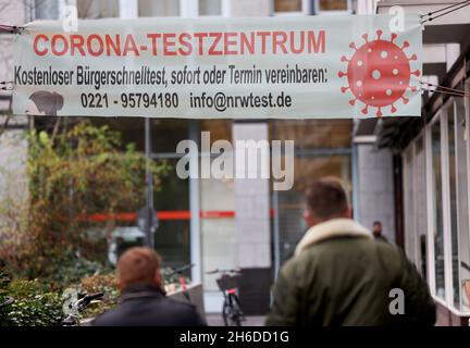 Cologne, Germany. 15th Nov, 2021. People go to a corona testing centre. The incidence of Corona continues to rise in North Rhine-Westphalia. Within seven days, the health offices reported 167 new infections per 100,000 inhabitants. (To dpa/lnw: 'Incidence in NRW rises to 167: national average clearly higher') Credit: Oliver Berg/dpa/Alamy Live News Stock Photo