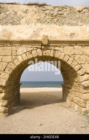 ruins of the Roman aqueduct in Caesarea , Israel, Caesarea Stock Photo