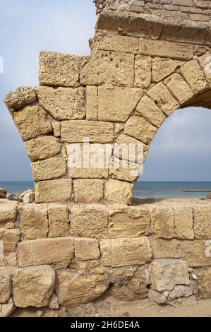 ruins of the Roman aqueduct in Caesarea , Israel, Caesarea Stock Photo