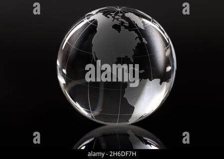 Closeup of glass globe on black background Stock Photo
