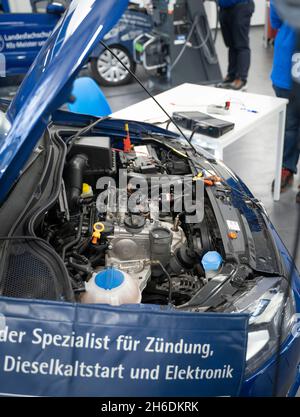 PRODUCTION - 12 November 2021, Hessen, Frankfurt/Main: A small car with an internal combustion engine at the national competition of the German automotive trade. The best of each federal state take part in the national competition. Photo: Frank Rumpenhorst/dpa Stock Photo